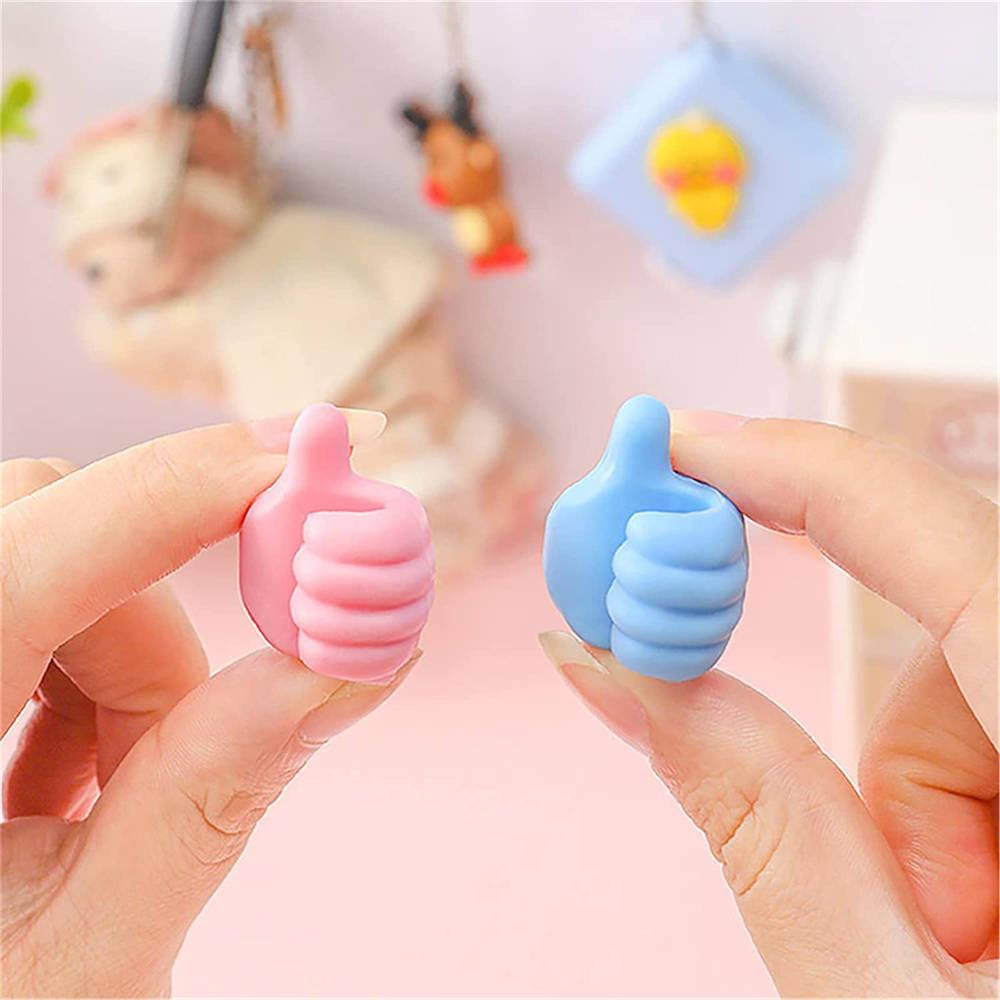 https://homeycomplex.com/products/thumbs-up-hook-multifunctional-mini-holder?variant=40956893757572